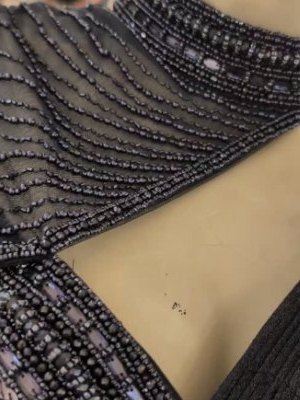 Detail of black bugle-bead blouse work